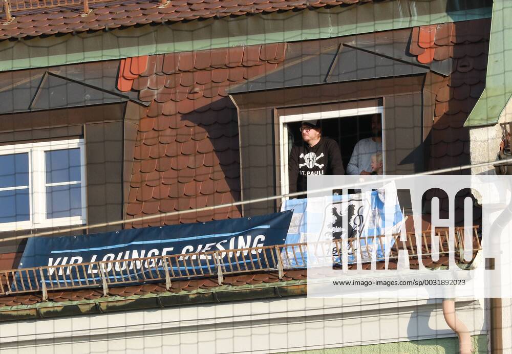 VIP Lounge Giesing 1860 fans watch the game on the opposite side of the street from her apartment from football Grünwald er Stadium 31 10 2017 TSV 1860 München SpVgg Bayreuth Bavaria