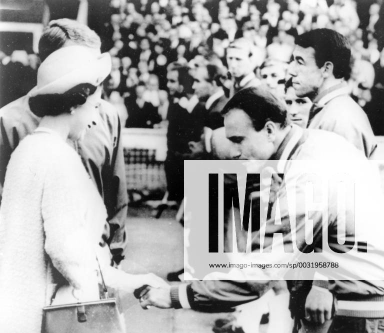 Alf imeets the Queen 1966 World Cup Football England team manager, Alf Ramsay, shakes hand with Queen Elizabeth II during the opening match of the World Cup, England vs. Uruguay, at Wembley. 11 July 1966, Wembley London United Kingdom England
