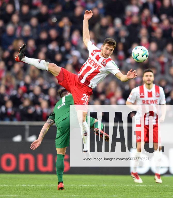 1. FC Cologne FC Augsburg 27 01 2018 s Acharya Cologne flies about Marcel Heller FCA HM