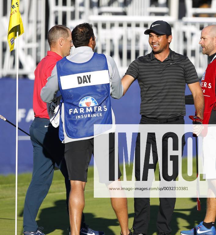 San Diego, CA, USA - Jason Day celebrates with caddie Rika Batibasaga after winning the Farmers Insurance Open at the Torrey Pines Golf Course on January 29, 2018. Day beat Alex Noren, left, in a playoff. Farmers Insurance Open Playoff - ZUMAs44_ 20180129_zaf_s44_004