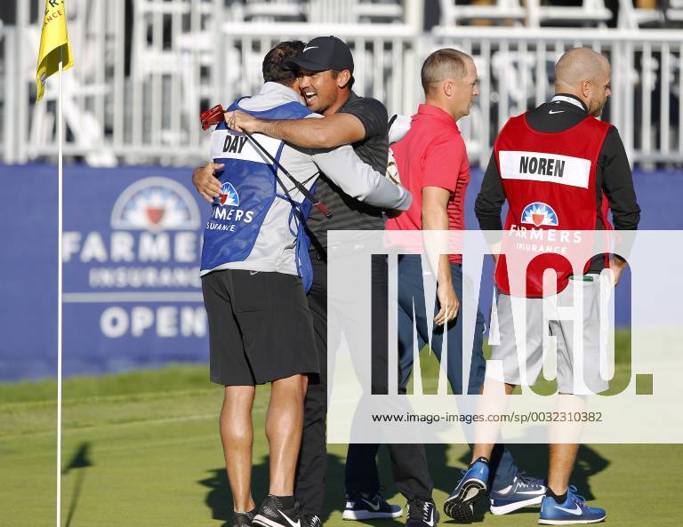 San Diego, CA, USA - Jason Day celebrates with caddie Rika Batibasaga after winning the Farmers Insurance Open at the Torrey Pines Golf Course on January 29, 2018. Day beat Alex Noren, right, in a playoff. Farmers Insurance Open Playoff - ZUMAs44_ 20180129_zaf_s44_005