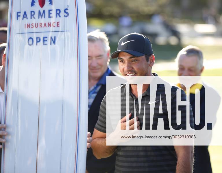 San Diego, CA, USA - Jason Day stands with a surfboard trophy after winning Farmers Insurance Open at the Torrey Pines Golf Course on January 29, 2018. Farmers Insurance Open Playoff - ZUMAs44_ 20180129_zaf_s44_006