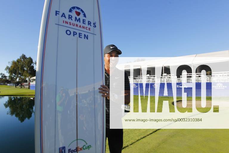 San Diego, CA, USA - Jason Day stands with a surfboard trophy after winning Farmers Insurance Open at the Torrey Pines Golf Course on January 29, 2018. Farmers Insurance Open Playoff - ZUMAs44_ 20180129_zaf_s44_007