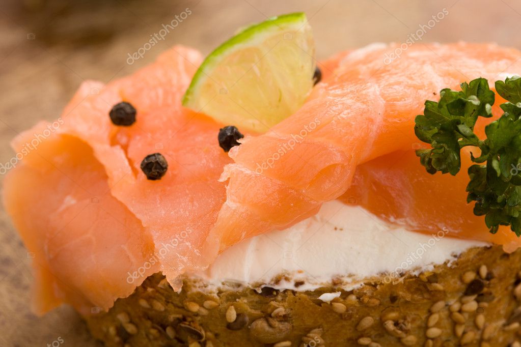 Photo of delicious crispy cereals bread with smoked salmon model released