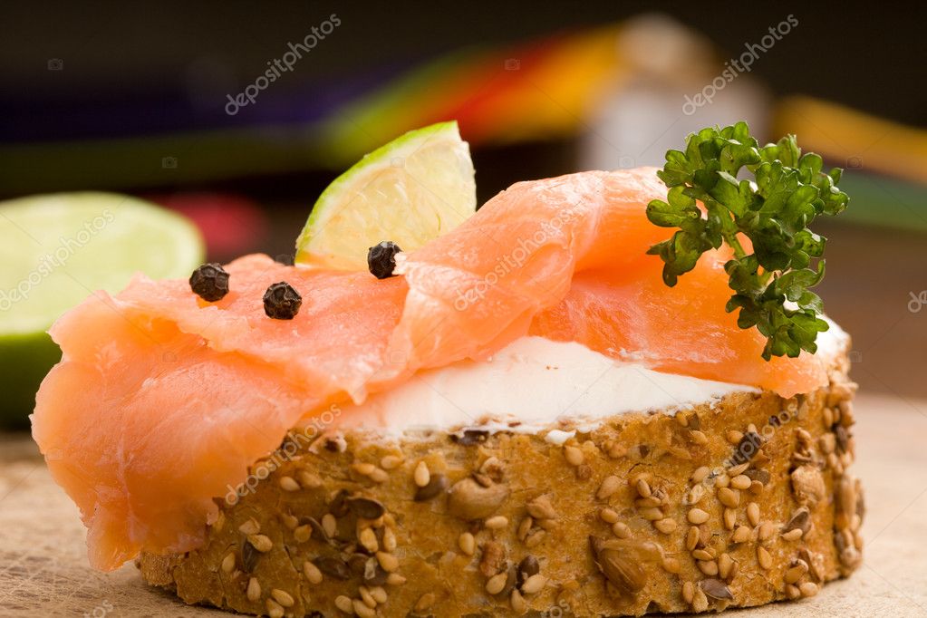 Photo of delicious crispy cereals bread with smoked salmon model released