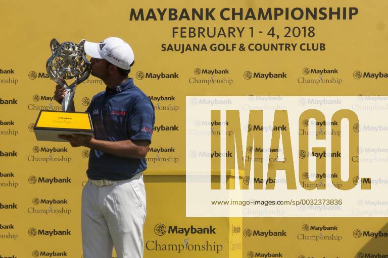 Shah Alam, Kuala Lumpur, Malaysia - Shubhankar Sharma pro golf player from India seen kissing his Maybank Championship trophy after he won by the score of 21 under 267 during day four...The Maybank Championship 2018 golf event is being hosted on 1st to 4th February 2018 at Saujana Golf & Country Club. Maybank prize ceremony - ZUMAs197 81793027st