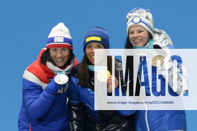 Pyeongchang, South Korea - MARIT BJOERGEN of Norway (left, silver medal), CHARLOTTE KALLA of Sweeden (center, gold) and KRISTA PARMAKOKI of Finland ( bronze) pose with their medals on the podium with their medals for the 7.5km + 7.5km Skiathlon event in the PyeongChang Olympic Games Olympische Spiele Olympia OS Pyeongchang 18: - ZUMAl132 20180210_zap_l132_011
