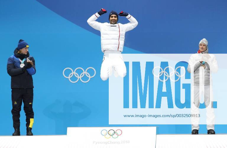 - SPORT (180213) -- PYEONGCHANG, Feb. 13, 2018 -- Champion Martin Fourcade (C) from France, second-placed Sebastian Samuelsson (L) from Sweden and third-placed Benedikt Doll from Germany pose for photos during medal ceremony of men s 12.5km pursuit event of biathlon at 2018 PyeongChang Winter Olympic Games Olympische Spiele Olympia OS at the Medal Plaza in PyeongChang, Feb. 13, 2018 (SP)OLY-SOUTH KOREA-PYEONGCHANG-BIATHLON-MEN S 12.5KM PERSUIT-MEDAL CEREMONY BaixXuefei