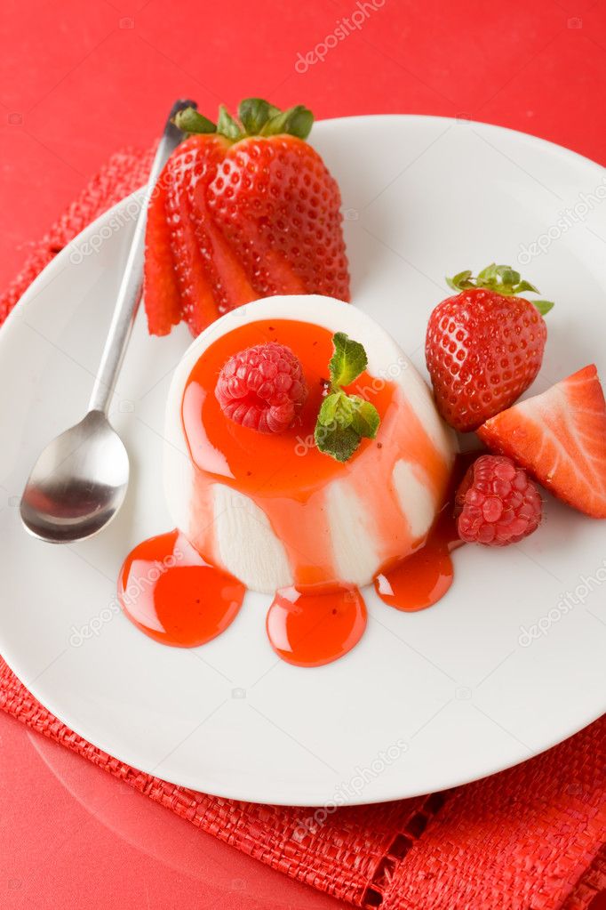 Photo of italian panna cotta dessert with strawberry sirup and mint leaf model released