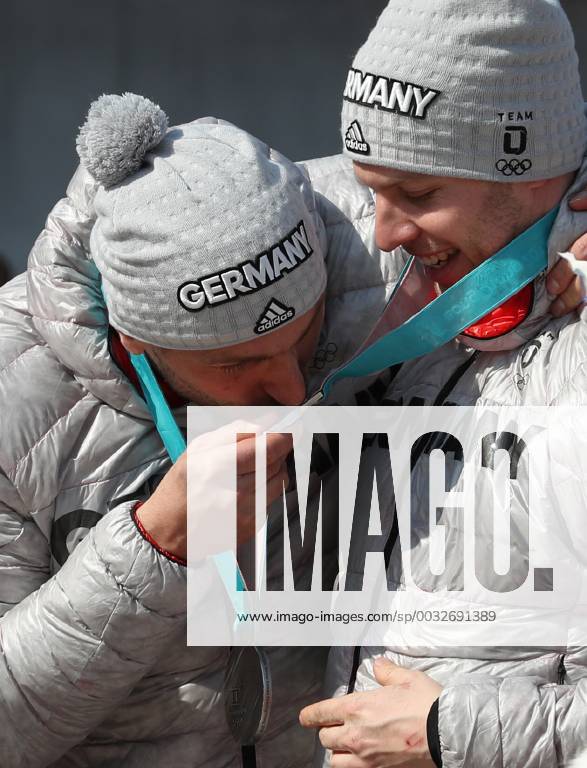 (180225) -- PYEONGCHANG, Feb. 25, 2018 -- An athlete of Germany kisses his teammate s silver medal after the 4-man event of bobsleigh at the 2018 PyeongChang Winter Olympic Games Olympische Spiele Olympia OS at Olympic Sliding Centre, PyeongChang, South Korea, Feb. 25, 2018. ) (SP)OLY-SOUTH KOREA-PYEONGCHANG-BOBSLEIGH-4-MAN BaixXuefei