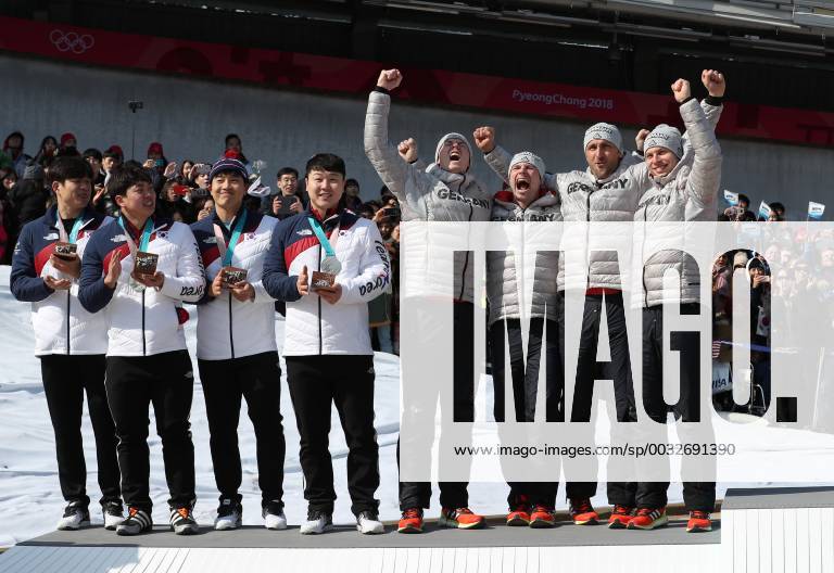 (180225) -- PYEONGCHANG, Feb. 25, 2018 -- The two equal silver medalists team Germany (R) and team South Korea pose for photos after the 4-man event of bobsleigh at the 2018 PyeongChang Winter Olympic Games Olympische Spiele Olympia OS at Olympic Sliding Centre, PyeongChang, South Korea, Feb. 25, 2018. ) (SP)OLY-SOUTH KOREA-PYEONGCHANG-BOBSLEIGH-4-MAN BaixXuefei