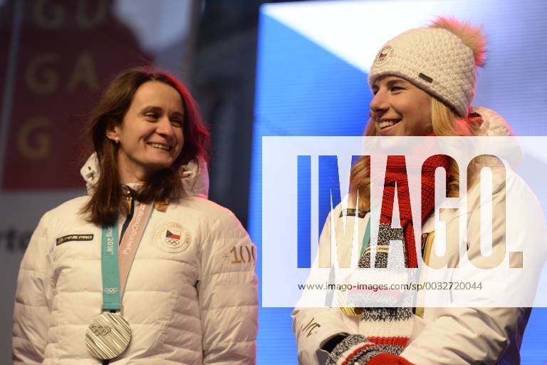 Silver Olympic medallist speed skater Martina Sablikova (left) and double Olympic gold medallist skier and snowboarder Ester Ledecka are seen on the podium during the celebration with fans on the Old Town Square in Prague, Czech Republic, on Monday, February 26, 2018, after the 2018 Winter Olympics in Pyeongchang, South Korea. (CTKxPhoto KaterinaxSulova) CTKPhotoP201802260817701 _SUK9151