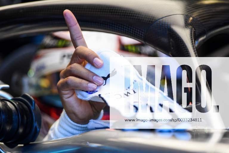 23rd March 2018, Melbourne Grand Prix Circuit, Melbourne, Australia; Melbourne Formula One Grand Prix, Friday free practice; Lewis Hamilton of Great Britain picks up his gloves as he climbs into the (44) Mercedes AMG Petronas F1 Team Mercedes WO9 on track ActionPlus12004127