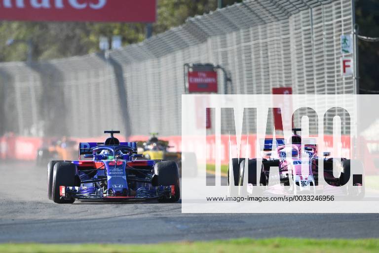 23rd March 2018, Melbourne Grand Prix Circuit, Melbourne, Australia; Melbourne Formula One Grand Prix, Friday free practice; Brendon Hartley of New Zealand driving the (28) Scuderia Toro Rosso STR13 Honda alongside Sergio Perez of Mexico, who is driving the (11) Sahara Force India F1 Team VJM11 Mercedes ActionPlus12004254