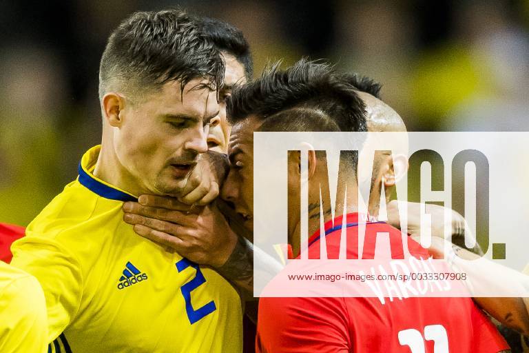 Sveriges Mikael Lustig and Chiles Eduardo Vargas during the football match between Sweden and Chile on March 24, 2018 in Stockholm Photo Joel Marklund BILDBYRAN Code JM 87663