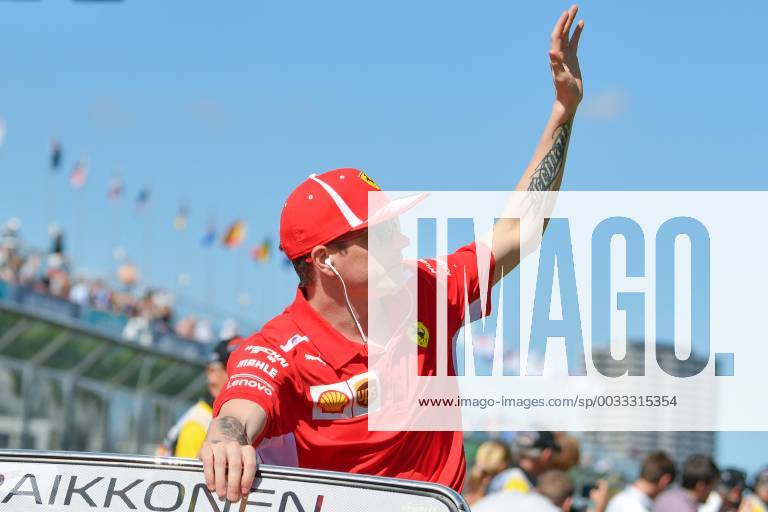 Kimi Raikkonen (FIN) 7 from the Scuderia Ferrari team waves to the crowd during the drivers parade at the 2018 Australian Formula One Grand Prix at Albert Park, Melbourne, Australia. Cal Media Formula One 2018: Australia - Race - ZUMAc04_ 20180325_zaf_c04_023