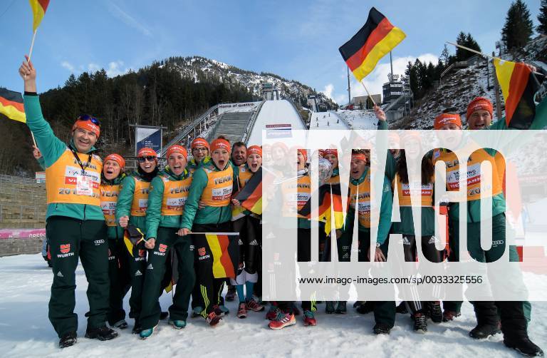 GER FIS Ski Jumping World Cup Ladies 25 03 2018 Audi Arena Oberstdorf GER FIS Ski Jumping World Cup Ladies pictured German team with Cup of the Nations Cup in the middle of the picture Katharina Althaus GER 47 with cup and coach Andreas Bauer nordphotoxHafner nph00200