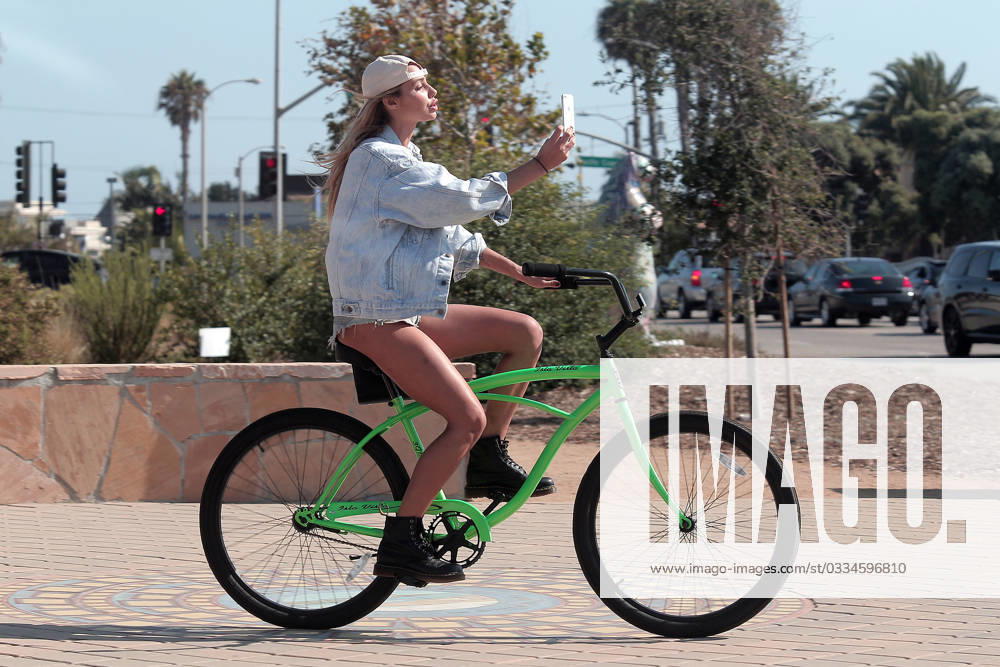 EXCLUSIVE: Sahara Ray takes selfies as she cycles around Malibu 156644, EXCLUSIVE: Sahara Ray takes selfies as she cycles around Malibu. Whilst at a light she checks her self out and then has her friend check something on her face., Credit:PacificCoastNews Avalon USA, Malibu