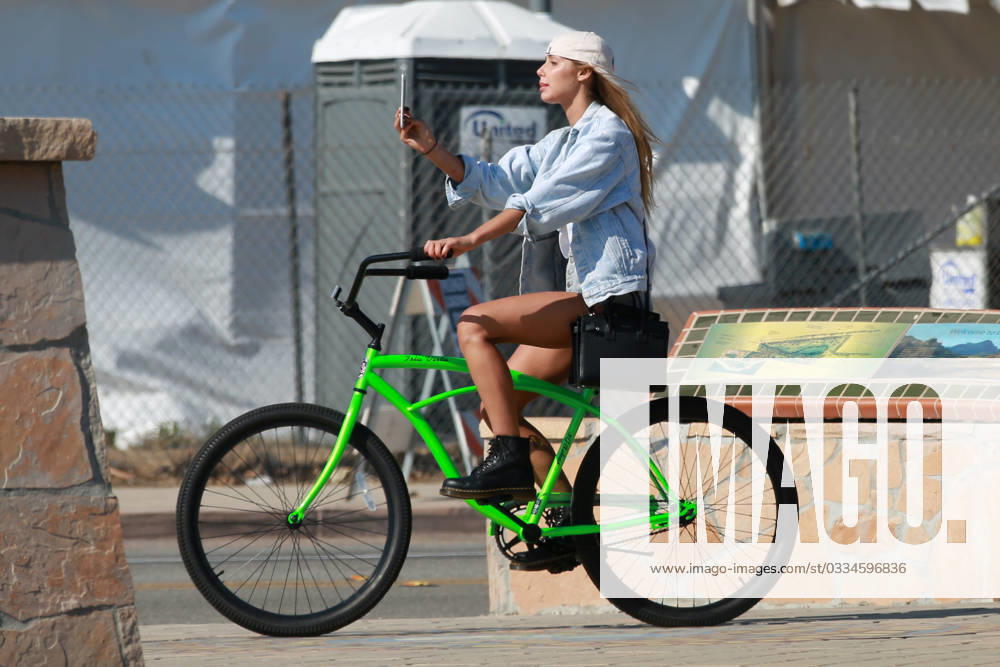 EXCLUSIVE: Sahara Ray takes selfies as she cycles around Malibu 156644, EXCLUSIVE: Sahara Ray takes selfies as she cycles around Malibu. Whilst at a light she checks her self out and then has her friend check something on her face., Credit:PacificCoastNews Avalon USA, Malibu