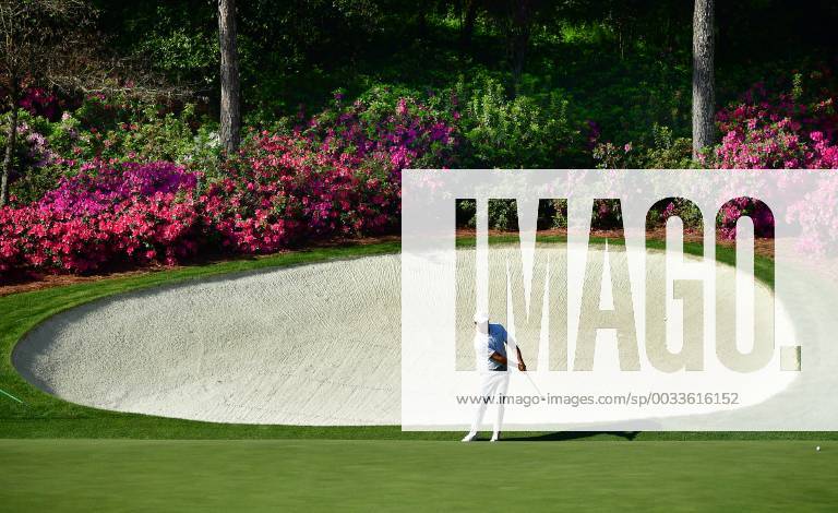 Tiger Woods chips on the 14th green during a practice round prior to the Masters golf tournament at the Augusta National Golf Club, on April 3, 2018 in Augusta, Georgia. AUG20180403324 KEVINxDIETSCH