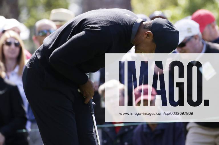 Tiger Woods reacts after hits tee shot on the 4th hole in the 1st round of the 2018 Masters Tournament at the Augusta National Golf Club in Augusta, Georgia, on April 5, 2018. AUG20180405119 JOHNxANGELILLO
