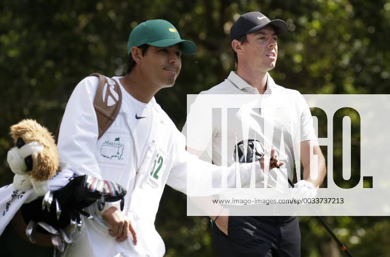 Rory McIlroy of Norther Ireland walks from the 2nd hole tee box wth caddie Harry Diamond after his tee shot in the 2nd round of the 2018 Masters Tournament at the Augusta National Golf Club in Augusta, Georgia, on April 6, 2018. AUG20180406119 JOHNxANGELILLO