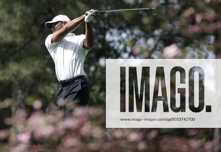Tiger Woods hits an iron from the second hole fairway in the 2nd round of the 2018 Masters Tournament at the Augusta National Golf Club in Augusta, Georgia, on April 6, 2018. AUG20180406131 JOHNxANGELILLO