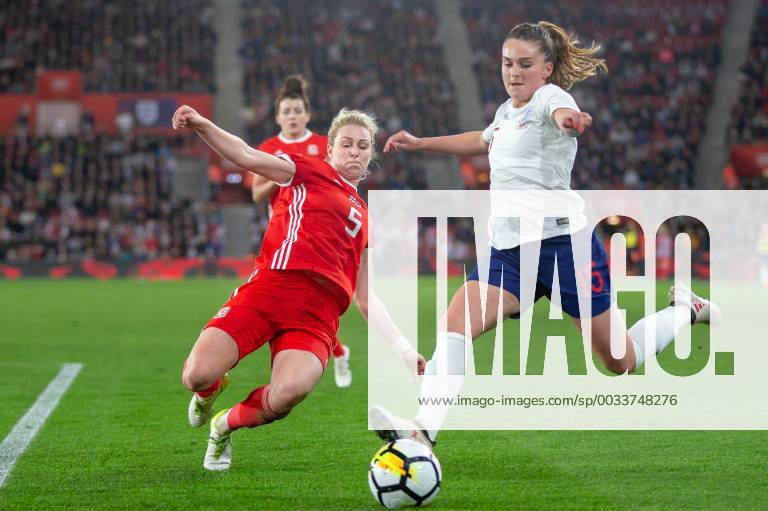 Melissa Lawley(15) of England crosses with Rhiannon Roberts(5) of Wales closing her down during the 2019 World Cup Qualification match between England Women and Wales Women at the St Mary s Stadium, Southampton, England on 6 April 2018.