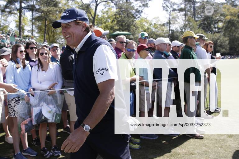 Phil Mickelson smiles as he walks to the second hole tee box in the 2nd round of the 2018 Masters Tournament at the Augusta National Golf Club in Augusta, Georgia, on April 6, 2018. AUG20180406140 JOHNxANGELILLO