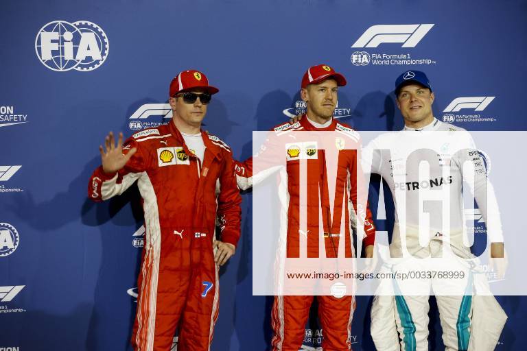 Sakhir, Kingdom of Bahrain - KIMI RAIKKONEN of Scuderia Ferrari, SEBASTIAN VETTEL of Scuderia Ferrari and VALTTERI BOTTAS of Mercedes AMG Petronas Motorsport are seen after the 2018 FIA Formula 1 Bahrain Grand Prix qualifying session at Bahrain International Circuit in Sakhir, Kingdom of Bahrain. Bahrain Grand Prix 2018 - Qualifying - ZUMAg147 20180407_zap_g147_042
