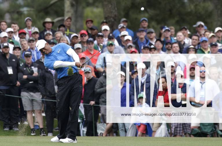 Tiger Woods hits his approach shot to hole 15in the 3rd round of the 2018 Masters Tournament at the Augusta National Golf Club in Augusta, Georgia, on April 7, 2018. AUG20180407113 JOHNxANGELILLO