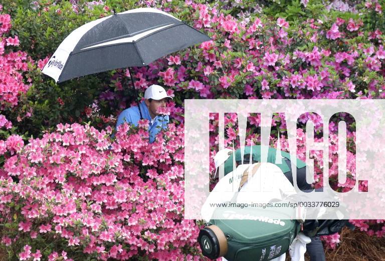 - SPORT Rory McIlroy of Northern Ireland holds an umbrella standing in a pack of azalea plants while caddie Harry Diamond and a referee identify his golf ball near the 13th green in the 3rd round of the 2018 Masters Tournament at the Augusta National Golf Club in Augusta, Georgia, on April 7, 2018. AUG20180407121 JOHNxANGELILLO