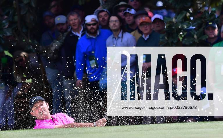 Patrick Reed hits out of a bunker on the 1st hole in the final round of the 2018 Masters Tournament at the Augusta National Golf Club in Augusta, Georgia, on April 8, 2018. AUG20180408105 KEVINxDIETSCH
