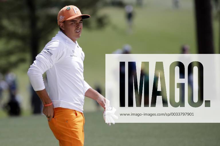 Rickie Fowler walks on the first hole fairway in the final round of the 2018 Masters Tournament at the Augusta National Golf Club in Augusta, Georgia, on April 8, 2018. AUG20180408113 JOHNxANGELILLO
