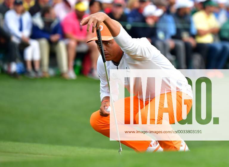 Rickey Fowler lines up a putt on the 18th green on the final day of the 2018 Masters Tournament at the Augusta National Golf Club in Augusta, Georgia, on April 8, 2018. Fowler finished second with 14-under-par AUG20180408337 KEVINxDIETSCH