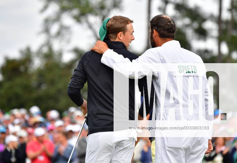 Jordan Spieth and his caddie Michael Greller walk off 18th green after finishing his final round during the 2018 Masters Tournament at the Augusta National Golf Club in Augusta, Georgia, on April 8, 2018. AUG20180408342 KEVINxDIETSCH