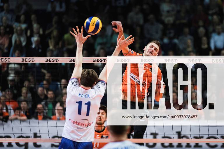 Berlin Germany 14 04 2018 Aleksandar Okolic BR Volleys 1 against the block from Tobias Krick RheinMain Volleys 11 at the Play Off Semifinals Game 1 of the Volleyball Bundesliga between Berlin Recycling Volleys and United Volleys Rhein Main