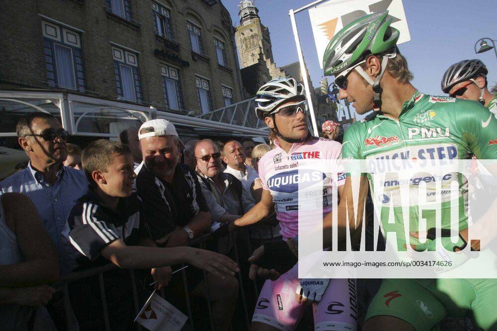 - DIKSMUIDE, BELGIUM: Belgian Tom Boonen of Quick Step (R) wearing his Tour De France green jersey and Italian Danilo Di Luca of Liquigas (C) pictured prior to the Diksmuide criterium, Tuesday 31 July 2007 in Diksmuide. Lots of cyclists who made the Tour De France attend the criterium. FRANCOIS WALSCHAERTS PETER DECONINCK x7165598x