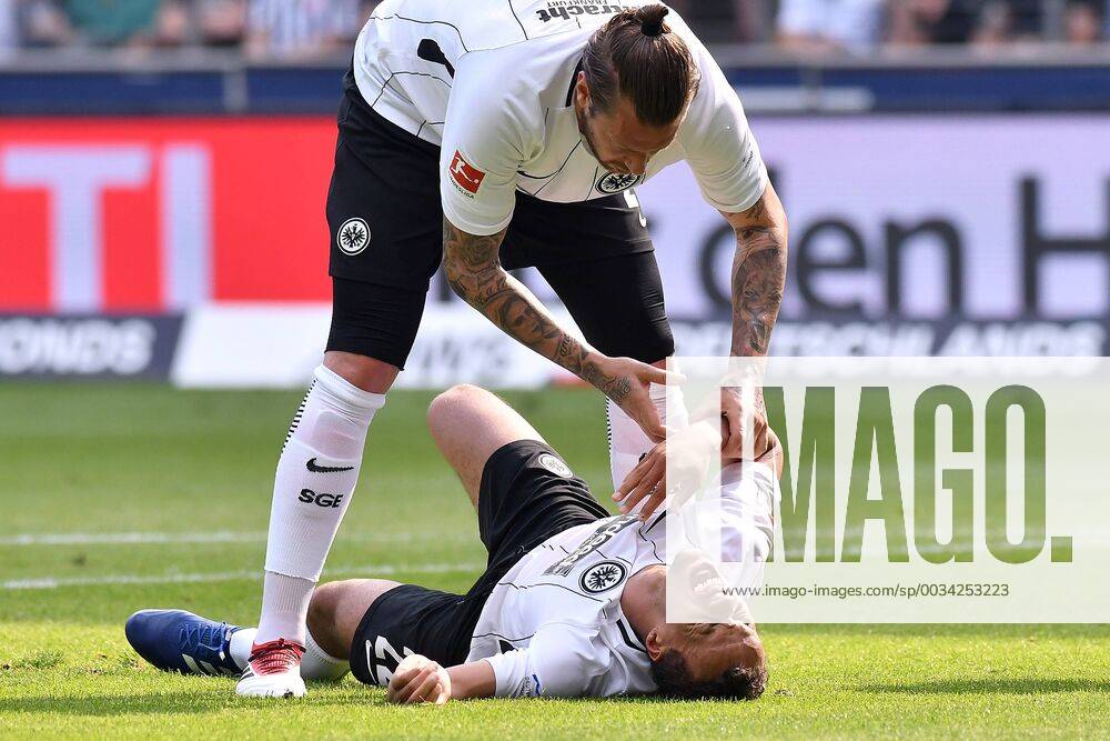 Soccer 1 Bundesliga 31 Matchday Eintracht Frankfurt Hertha BSC Berlin on 21 04 2018 in the Commerzbank Arena in Frankfurt Timothy Chandler Frankfurt with pain on the ground Marco Russ Frankfurt above