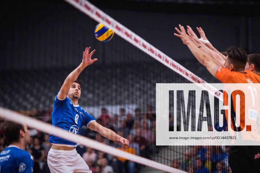 Friedrichshafen Germany 26 04 2018 Martin Atanasov Friedrichshafen 8 against the block from Adam White BR Volleys 11 and Graham Vigrass BR Volleys 8 in the Playoff Final Game 1 of the Volleyball Bundesliga between VfB Friedrichshafen and the Berlin Recycling Volleys