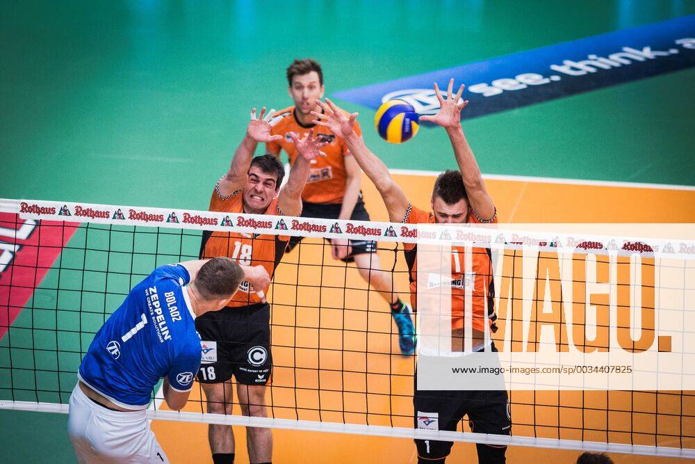 Friedrichshafen Germany 26 04 2018 Bartlomiej Boladz Friedrichshafen 1 against the block from Pierre Pujol BR Volleys 18 and Aleksandar Okolic BR Volleys 1 in the Playoff Final Game 1 of the Volleyball Bundesliga between VfB Friedrichshafen and the Berlin Recycling Volleys