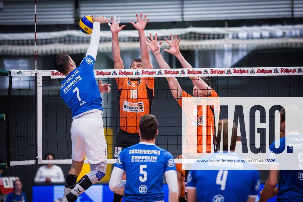 Friedrichshafen Germany 26 04 2018 Athanasios Protopsaltis Friedrichshafen 7 against the block from Pierre Pujol BR Volleys 18 and Graham Vigrass BR Volleys 8 in the Playoff Final Game 1 of the Volleyball Bundesliga between VfB Friedrichshafen and the Berlin Recycling Volleys