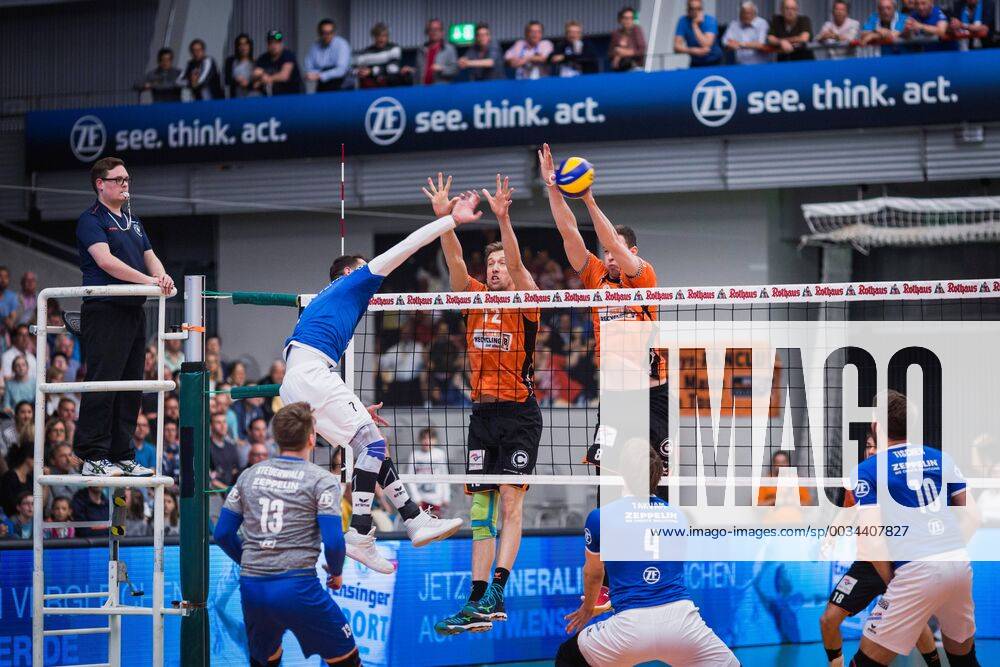 Friedrichshafen Germany 26 04 2018 Athanasios Protopsaltis Friedrichshafen 7 against the block from Paul Carroll BR Volleys 12 and Graham Vigrass BR Volleys 8 in the Playoff Final Game 1 of the Volleyball Bundesliga between VfB Friedrichshafen and the Berlin Recycling Volleys