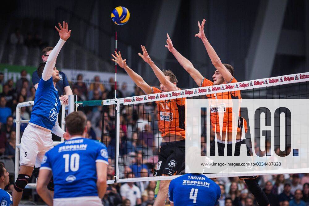 Friedrichshafen Germany 26 04 2018 David Sossenheimer Friedrichshafen 5 against the Paul Carroll block BR u200b u200bVolleys 12 and Aleksandar Okolic BR Volleys 1 in the Playoff Final Game 1 of the Volleyball Bundesliga between VfB Friedrichshafen and the Berlin Recycling Volleys
