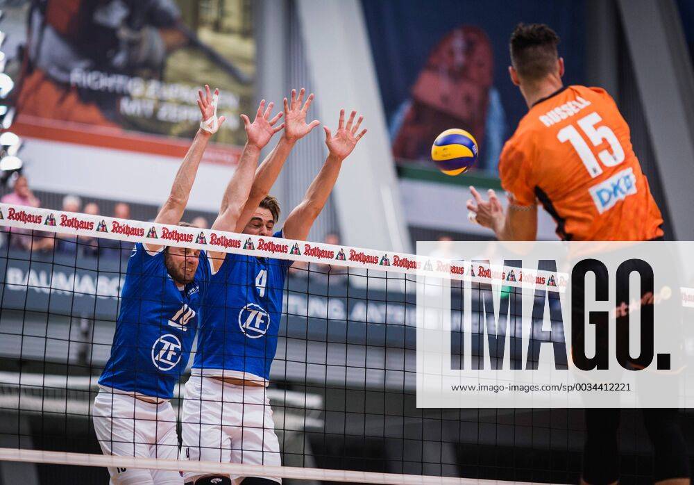 Friedrichshafen Germany 26 04 2018 Russell Kyle BR Volleys 15 against the block from Simon Tischer Friedrichshafen 10 and Andreas Takvam Friedrichshafen 4 at the Playoff Final Game 1 of the Volleyball Bundesliga between VfB Friedrichshafen and the Berlin Recycling Volleys