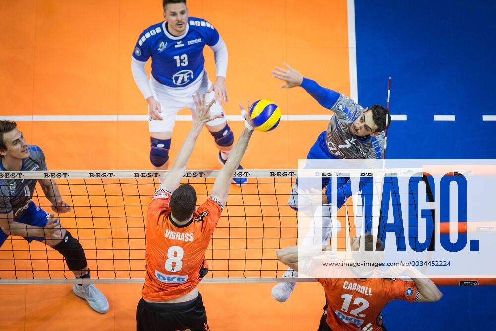 Berlin Germany 29 04 2018 Athanasios Protopsaltis Friedrichshafen 7 against the block from Graham Vigrass BR Volleys 8 and Paul Carroll BR Volleys 12 at Playoff Final Game 2 of the Volleyball Bundesliga between Berlin Recycling Volleys and VfB Friedrichshafen