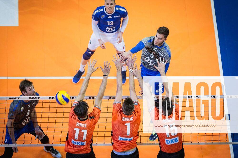 Berlin Germany 29 04 2018 David Sossenheimer Friedrichshafen 5 against the block from Adam White BR Volleys 11 Aleksandar Okolic BR Volleys 1 and Russell Kyle BR Volleys 15 at Playoff Final Game 2 of the Volleyball Bundesliga between Berlin Recycling Volleys and VfB Friedrichshafen