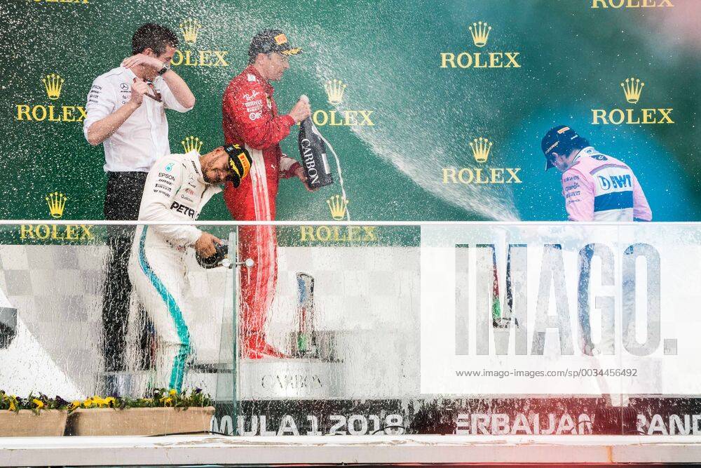 (180429) -- BAKU, April 29, 2018 -- Mercedes Lewis Hamilton (2nd L) of Britain celebrates with Peres of Mexico on the podium during the awarding ceremony for Azerbaijan Formula One Grand Prix in Baku, Azerbaijan, April 29, 2018. ) (SP)AZERBAIJAN-BAKU-F1-AZERBAIJAN GRAND PRIX WuxZhuang