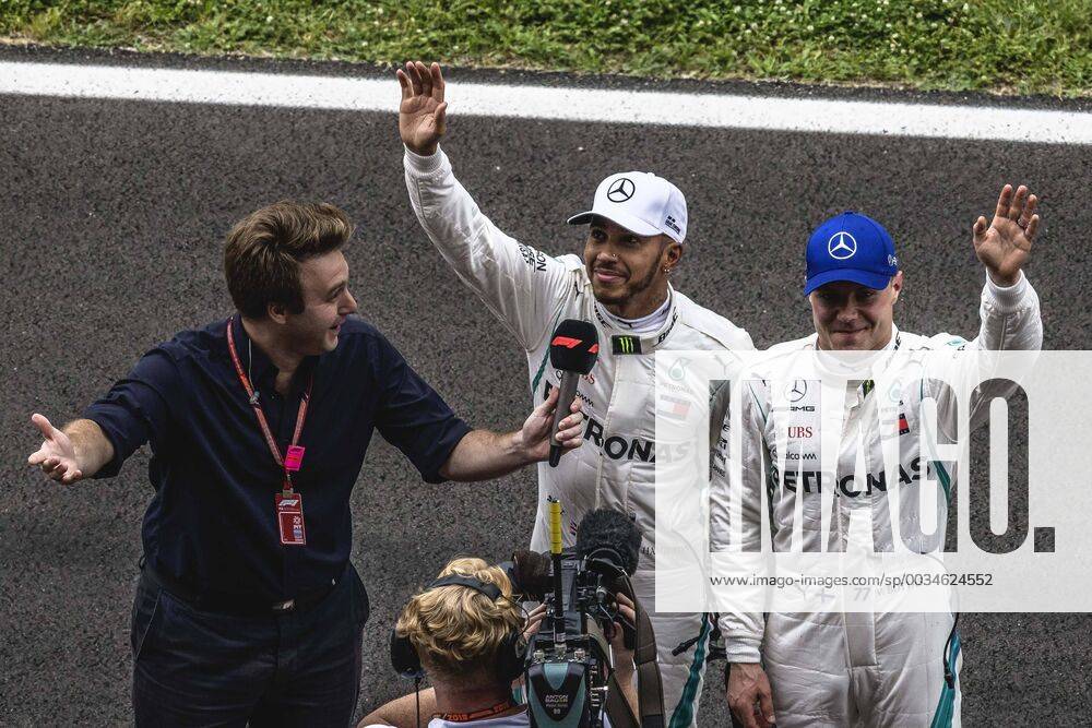 Barcelona, Catalonia, Spain - LEWIS HAMILTON (GBR) and VALTTERI BOTTAS (FIN) from Mercedes greet the crowd as they are interviewed after winning the Pole Position for the Spanish GP at Circuit de Barcelona - Catalunya F1 2018: Spanish Grand Prix: Hamilton Wins Pole - ZUMAo105 20180512_zap_o105_010