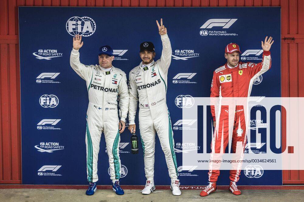 Barcelona, Catalonia, Spain - VALTTERI BOTTAS (FIN), 2nd, LEWIS HAMILTON (GBR), 1st and SEBASTIAN VETTEL (GER), 3rd, greet the crowd after winning the Pole Position for the Spanish GP at Circuit de Barcelona - Catalunya F1 2018: Spanish Grand Prix: Hamilton Wins Pole - ZUMAo105 20180512_zap_o105_015